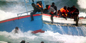 Rescuers help people in the sea after a