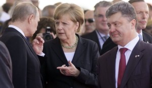 ukrainian-president-petro-poroshenko-german-chancellor-angela-merkel-and-russian-president-vladimir-putin-talk-in-france-in-june-6-2014-photo-reuters-1515721-1598318625