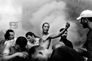 © PAOLO PELLEGRIN/MAGNUM PHOTOS, Moments after an Israeli air strike destroyed several buildings in Dahia. Beirut. August 2006